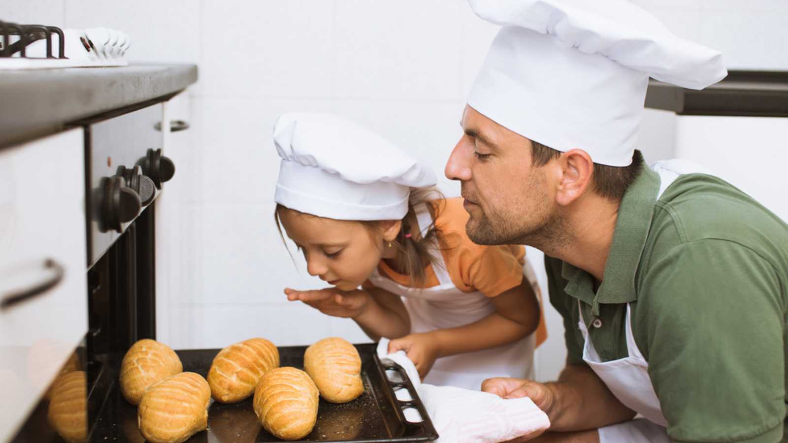 Father and kid in baking class