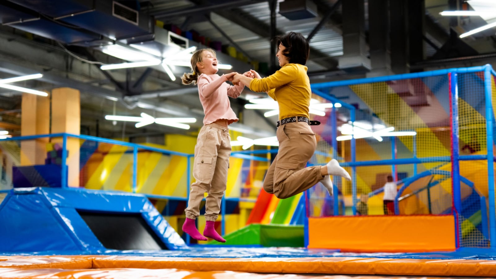 kid and grandmother at trampoline park