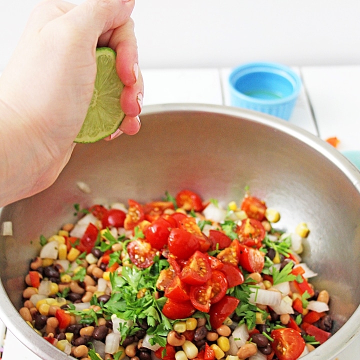 mixing the ingredients for Texas Caviar or Cowboy Caviar