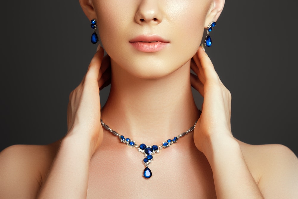 woman wearing sapphire necklace