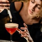 Woman making a fancy cocktail