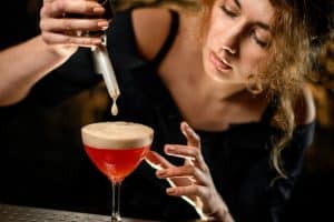 Woman making a fancy cocktail