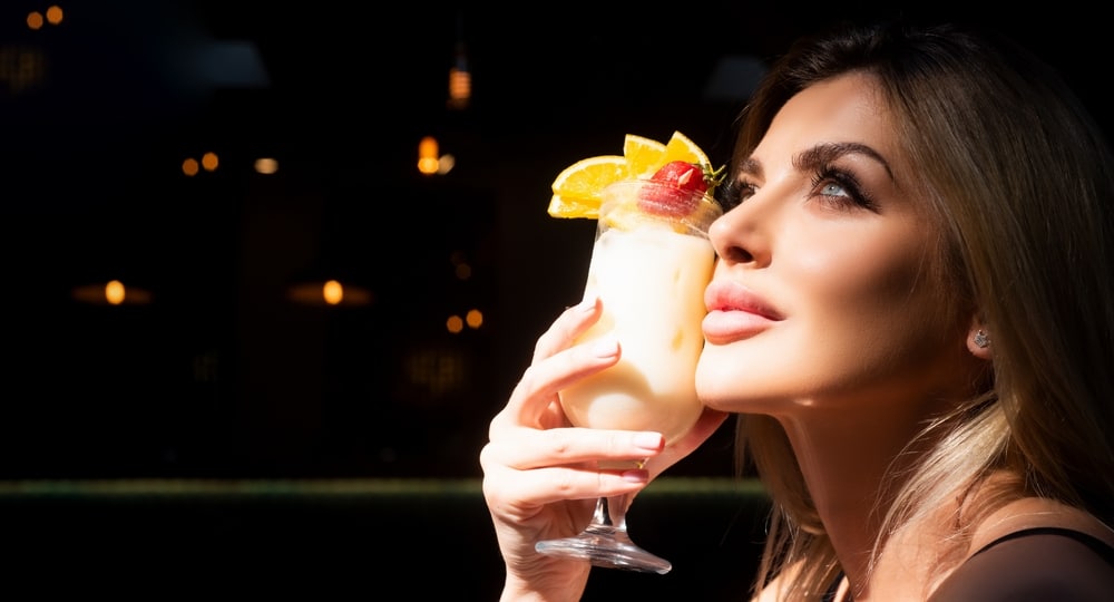 Woman drinking a cocktail